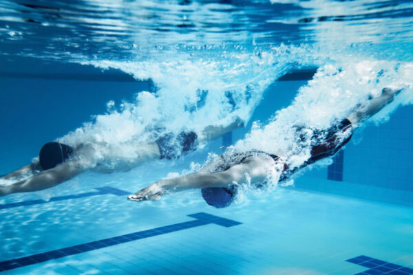 swimmer  Jump from platform jumping A swimming pool.Underwater photo